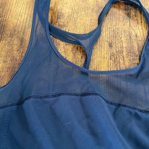 Lightly used Lululemon strappy back mesh tank top.